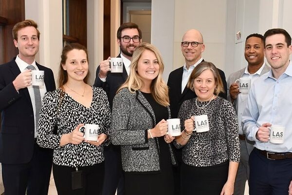 volunteers' with LAS mugs
